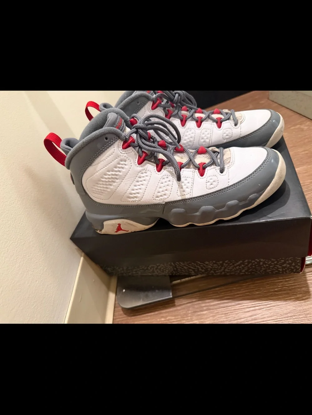 White and Gray Athletic Sneakers with Red Accents